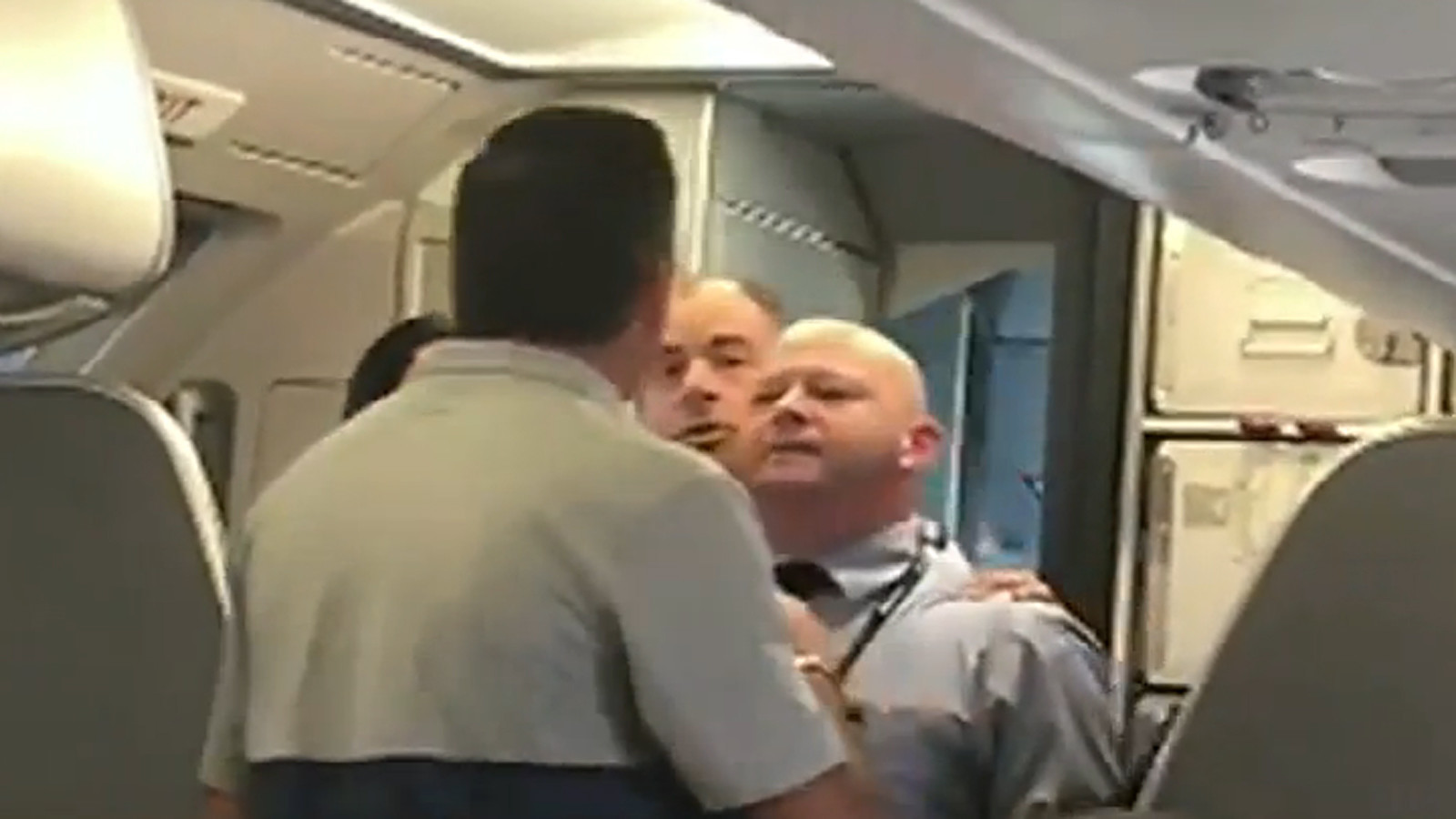 American Airlines flight attendant tells angry passenger: 'Hit me. Bring it on'