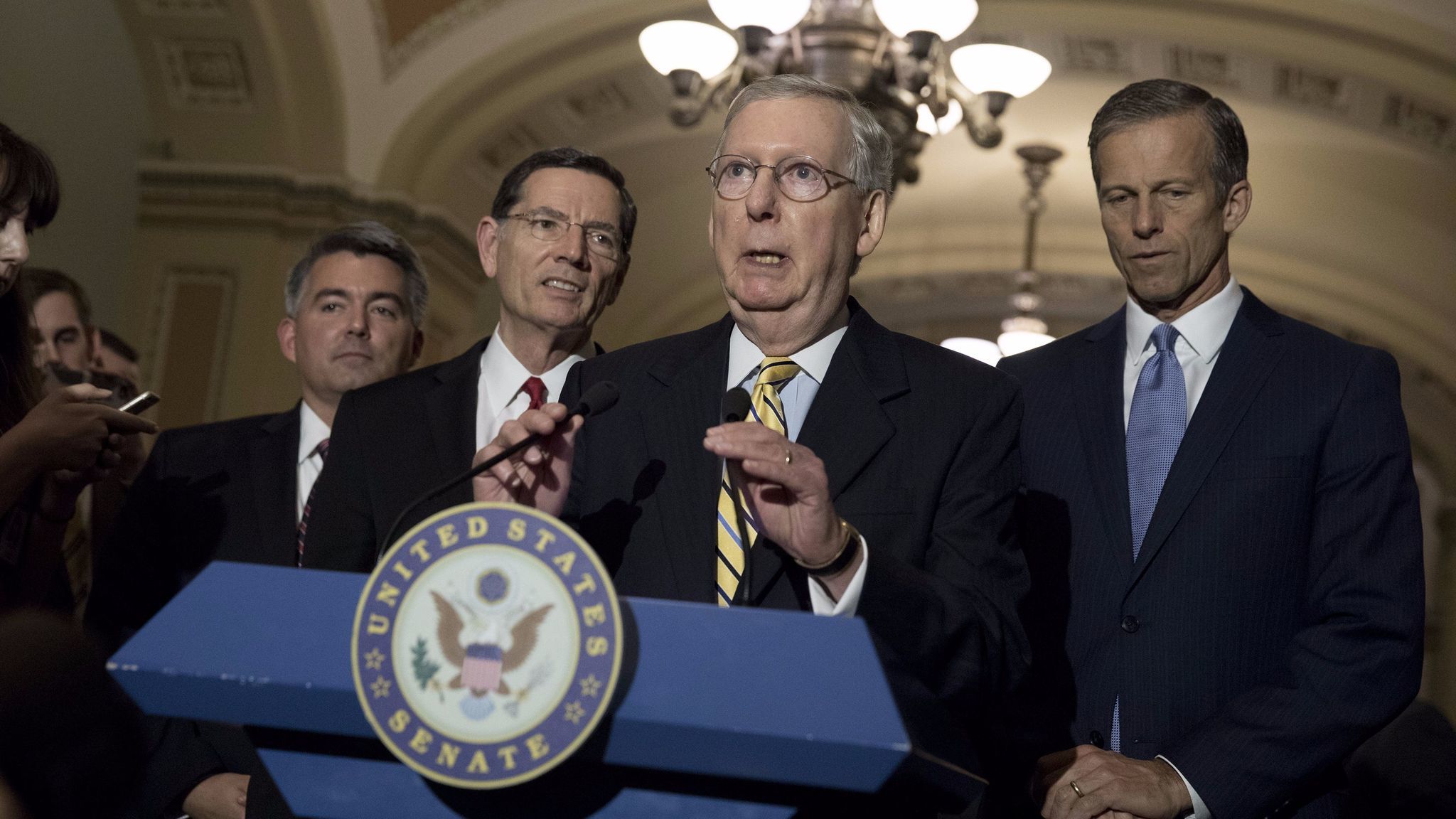 Senate Majority Leader Mitch McConnell (R-Ky.), flanked by Sen. Cory Gardner (R-Colo.), Sen. John Barrasso (R-Wyo.) and Sen. John Thune (R-S.D.), speaks to the media about the recent spending bill that averted a government shutdown.