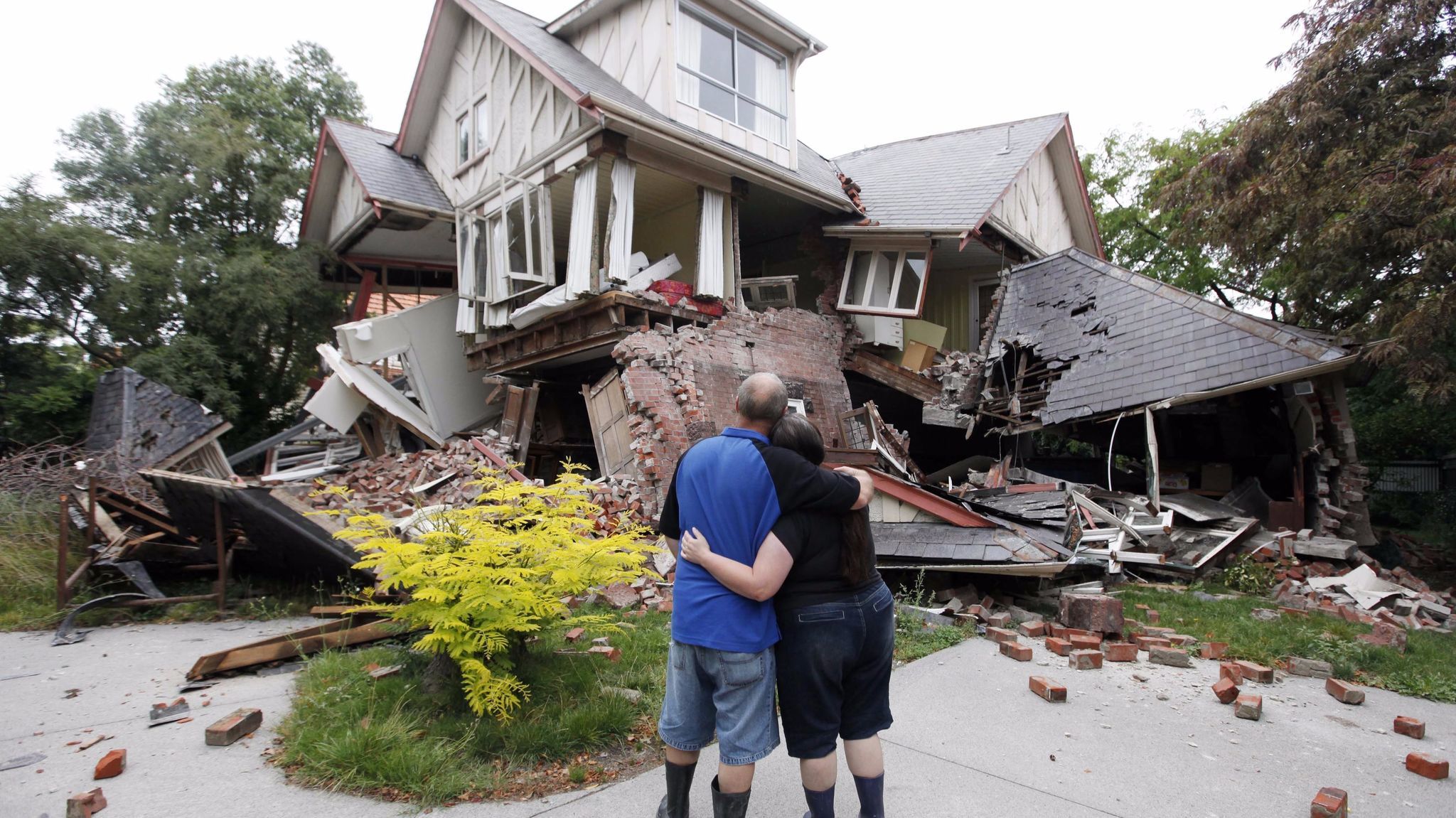 Murray and Kelly James look at their Christchurch, New Zealand, home, destroyed in an earthquake in 2011.