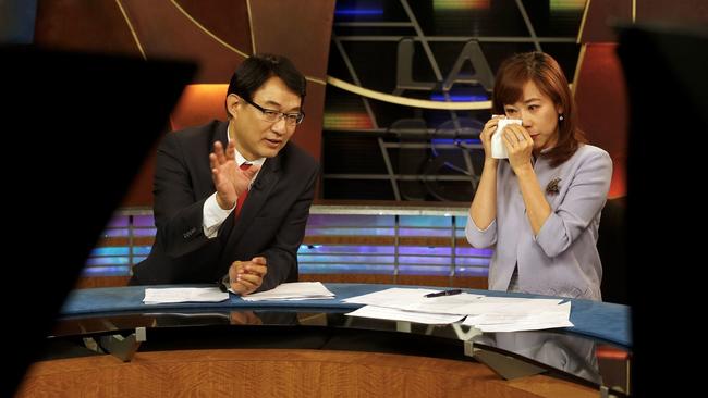 Channel 18 news anchors Harry Chang and Christine Chiang, right, lead their final KSCI-TV broadcast
