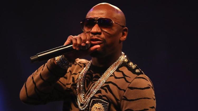 Floyd Mayweather Jr., above, boasts an undefeated record, while Conor McGregor has made his name in