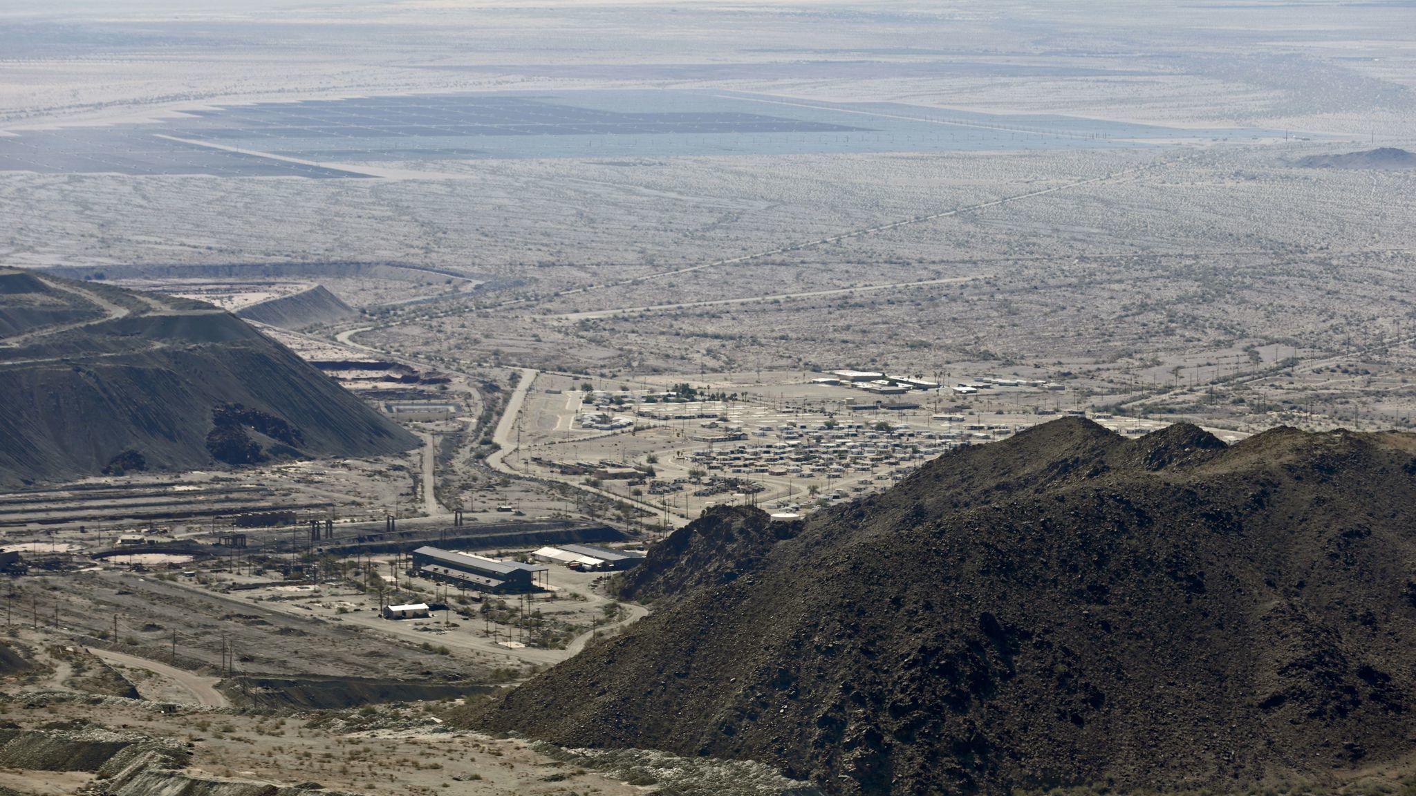 A view of the lower portion of the Eagle Mountain mine site and abandoned company town. A large solar farm is in the distance.