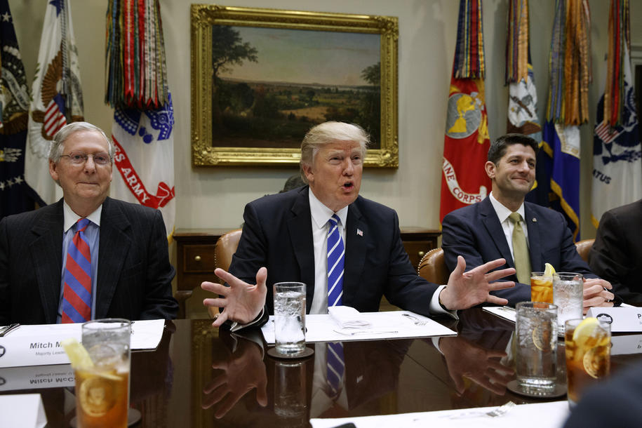 President Trump, flanked by Senate Majority Leader Mitch McConnell of Kentucky, left, and House Speaker Paul Ryan of Wisconsin, speaks at the White House.  Photograph: Evan Vucci/Associated Press.