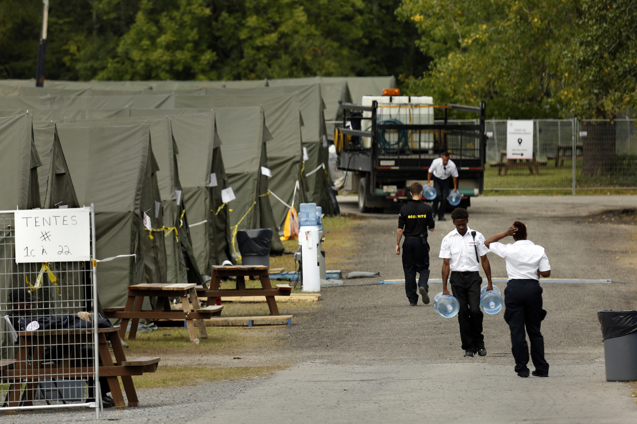 Members of the Canadian armed forces set up a tent village to house migrants while they wait to file asylum applications at the official port of entry in St. Bernard de Lacolle.