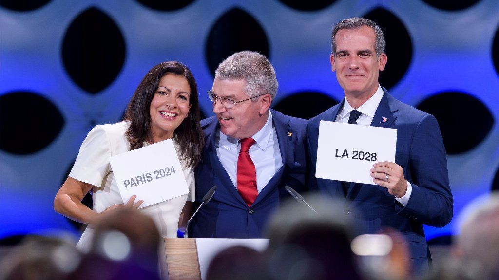 International Olympic Committee President Thomas Bach, center, with Paris Mayor Anne Hidalgo and L.A. Mayor Eric Garcetti after awarding the 2024 and 2028 Olympic Games to their cities in July.