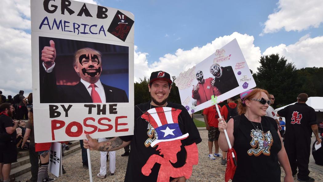 Fans of the group Insane Clown Posse, known as Juggalos, hold placards mocking President Trump during a September 16th protest in Washington.  Photograph: Paul J. Richards/Agence France-Presse/Getty Images.