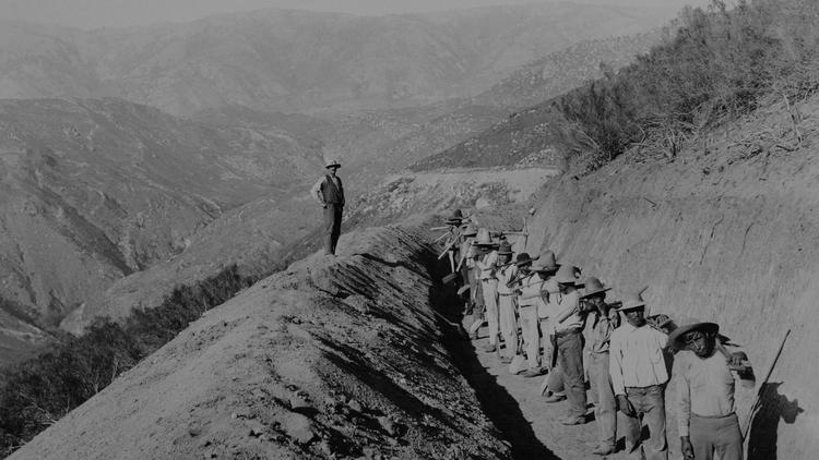Photo of the "finishing" workers working on the Escondido Canal in this view that shows Palomar Moun