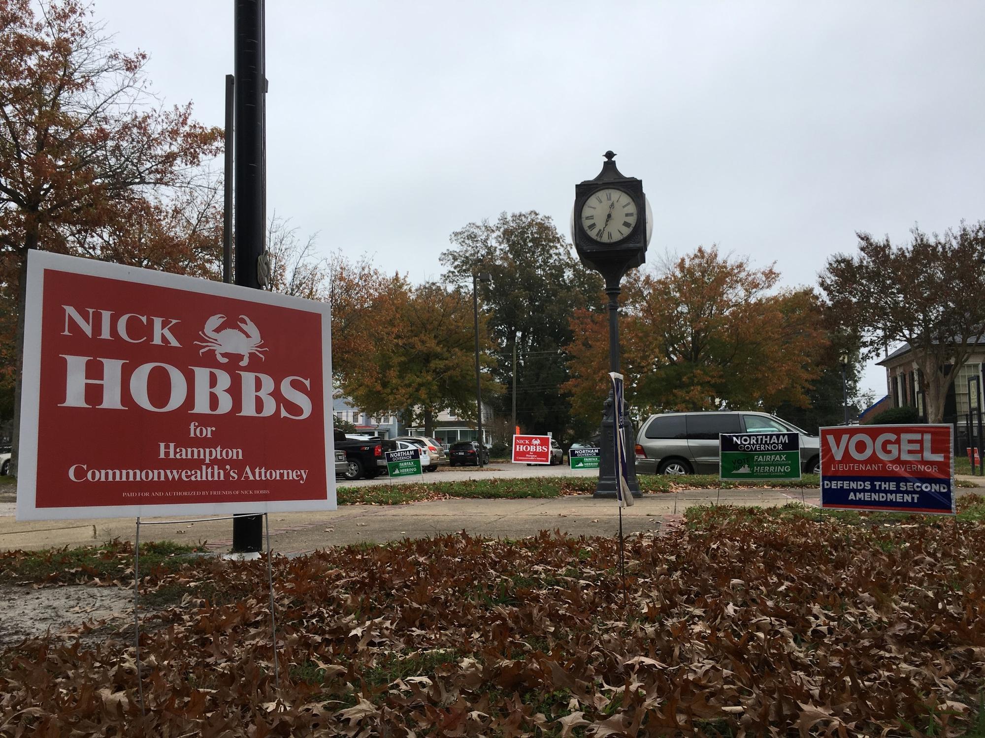 Signs for candidates peppered the parking lot outside the polling place at the Hampton Main Library, where the stream of voters Tuesday morning was busier than usual for a state election.