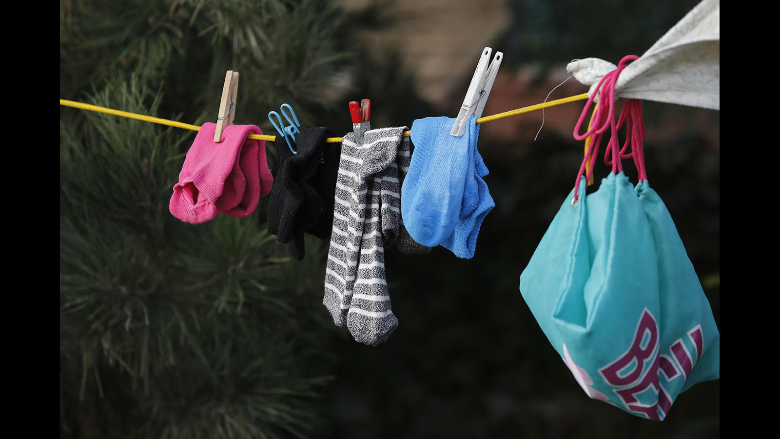 Socks are hung to dry outside Lisa Weber's camp along the Santa Ana River.