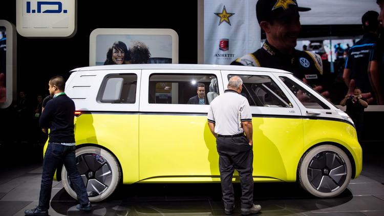 LOS ANGELES, CA - NOVEMBER 30: People look at the Volkswgen ID Buzz concept vehicle at "Automobility