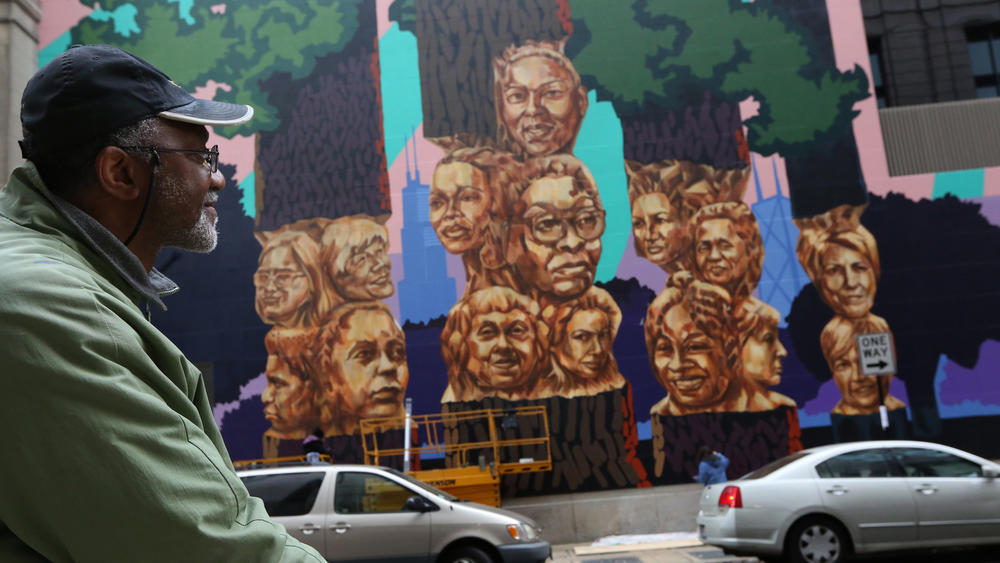Marshall and the mural. Photo: Nancy Stone/Chicago Tribune