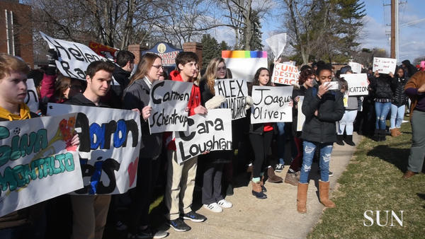 Students walk out of Franklin High School as part of nationwide demonstration