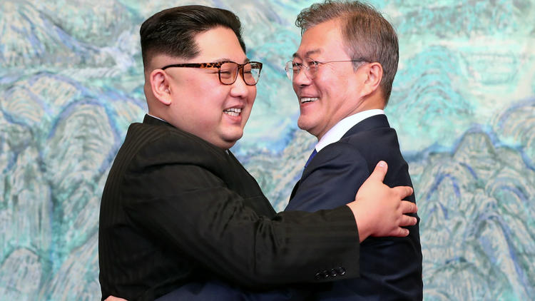 Kim Jong-un becomes the first North Korean dictator to cross into the South for 65 years, shakes hands with sworn enemy President Moon Jae-in and admits his 'heart is throbbing' with nerves  750x422