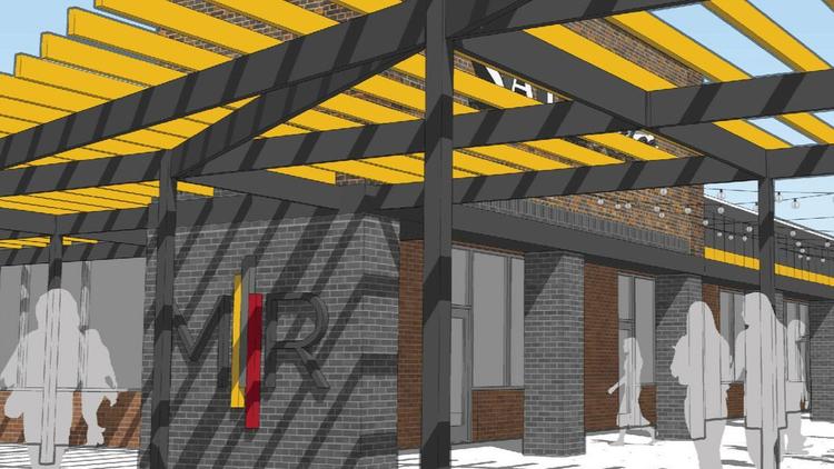 The project will feature outdoor gathering spaces like a sitting area covered by a metal pergola connected to Building 7, pictured here.