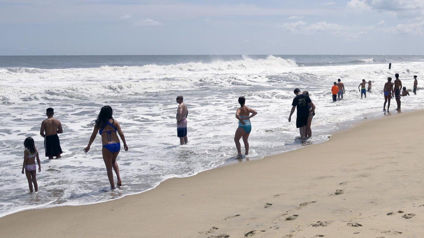 Wandering buskers and topless sunbathers take Ocean City 