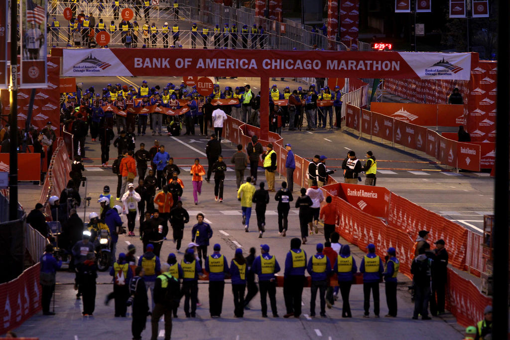 Elite runners warm up for the Bank of America Chicago Marathon on Columbus Drive early Sunday.