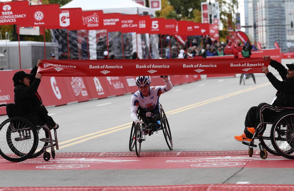 Tatyana McFadden, from the University of Illinois, wins the women's wheelchair division of the Bank of America Chicago Marathon in a time of 1:49.52. McFadden won three Gold Medals at 2012 Paralympics.