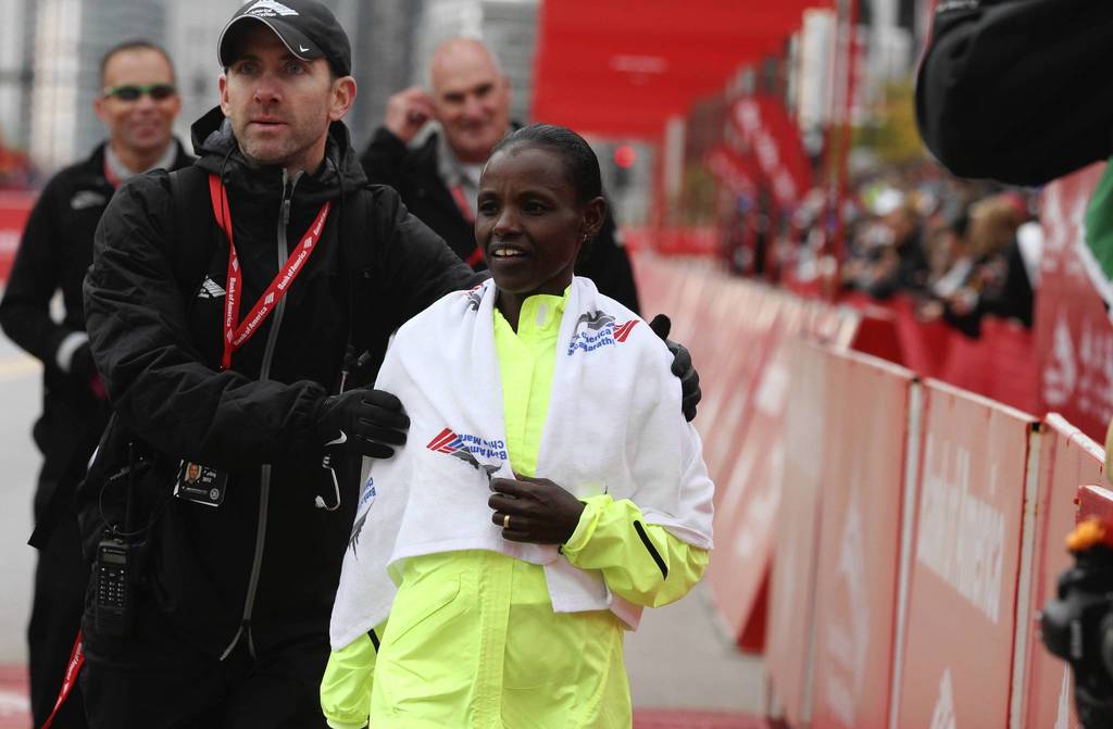 Ethiopian Atsede Baysa cools down after narrowly edging out her competitor, Kenya's Rita Jeptoo, to win the 2012 Bank of America Chicago Marathon in a time of 2 hours 22 minutes 3 seconds.
