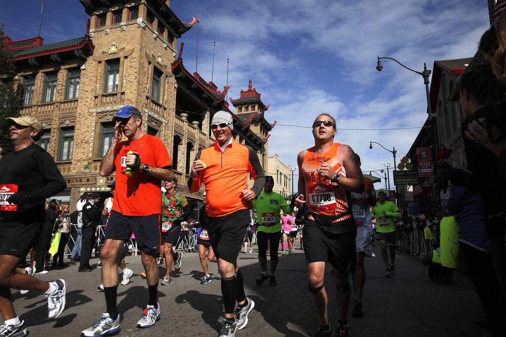 Thousands of runners from all over the world participate in the 35th Bank of America Chicago Marathon, running through many of Chicago's neighborhoods, including Chinatown.