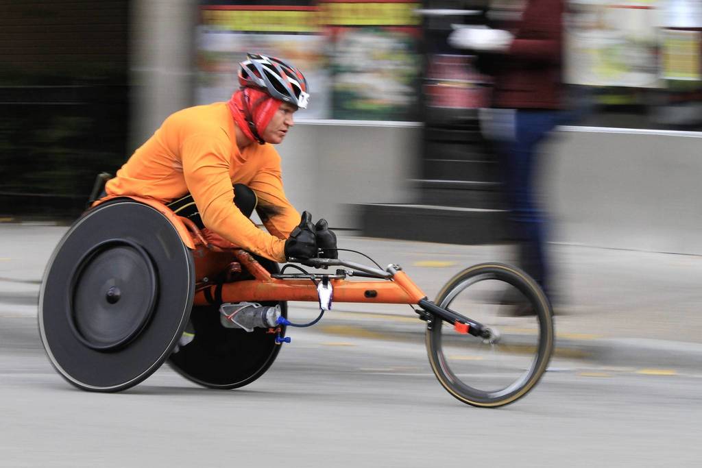 The streets of the Pilsen neighborhood are filled with wheelchair racers, runners and cheering spectators at mile 19 of the Bank of America Chicago Marathon.