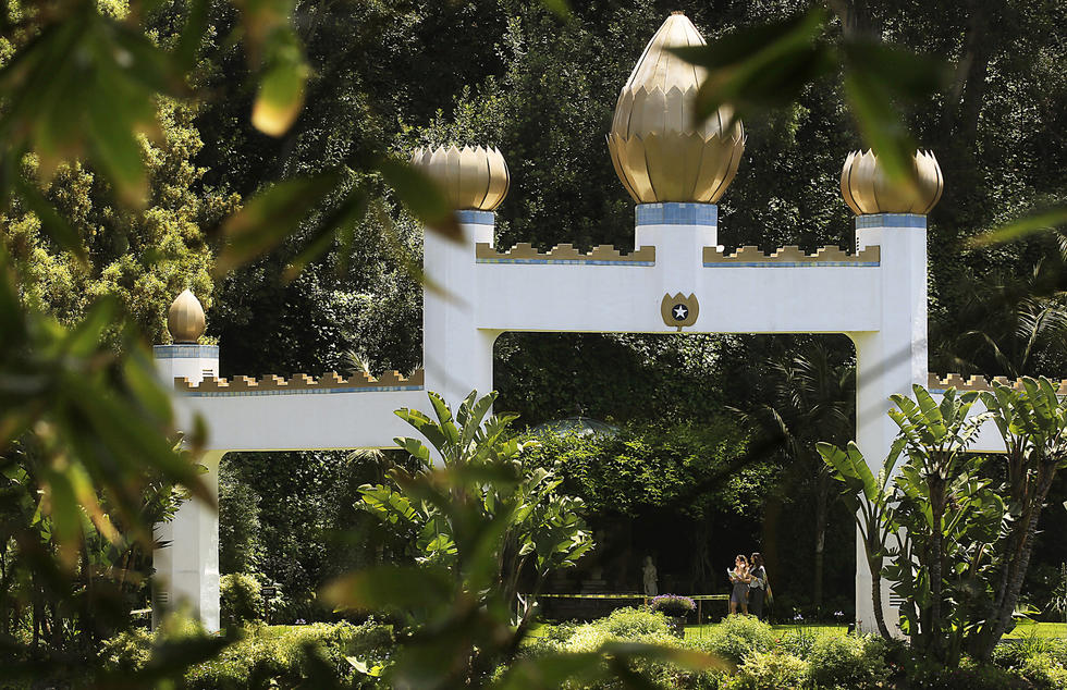 Caption: The Self-Realization Fellowship Lake Shrine Temple offers a verdant view along its Sunset Boulevard perch in Pacific Palisades. (Luis Sinco / Los Angeles Times)