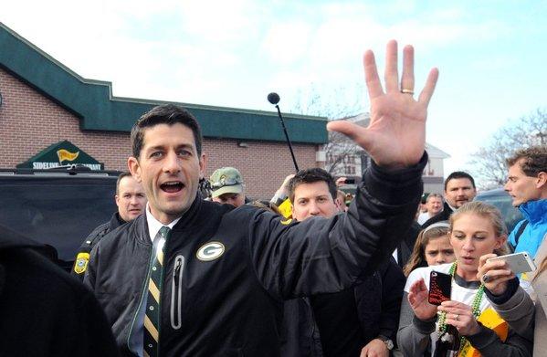 Republican vice presidential candidate Paul Ryan campaigns with Green Bay Packers fans before Sunday's game against the Arizona Cardinals in Green Bay, Wis.