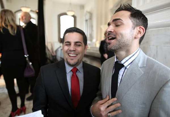 Paul Katami, right, and Jeff Zarillo, left, speak after a federal appeals court struck down California's ban on same-sex marriage last year.