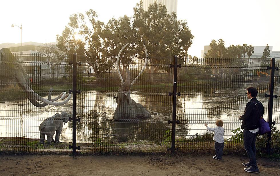 The La Brea Tar Pits sit bubbling along Wilshire, a reminder of the boulevard's primordial significance to Los Angeles. (Luis Sinco / Los Angeles Times)