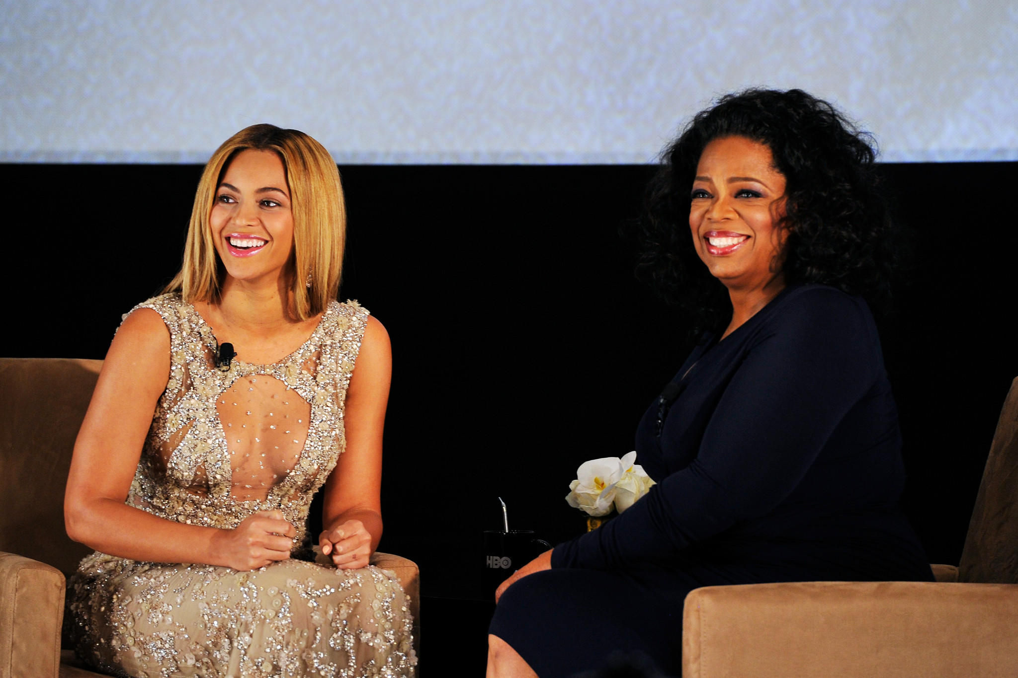 Beyoncé, left, and Oprah will join other celebrities in an hourlong fundraiser for Hurricane Harvey relief. (Larry Busacca / Getty Images)