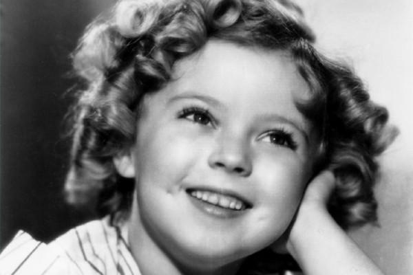 Shirley Temple Black, shown in 1935, shows of her signature curls and mega-watt smile.