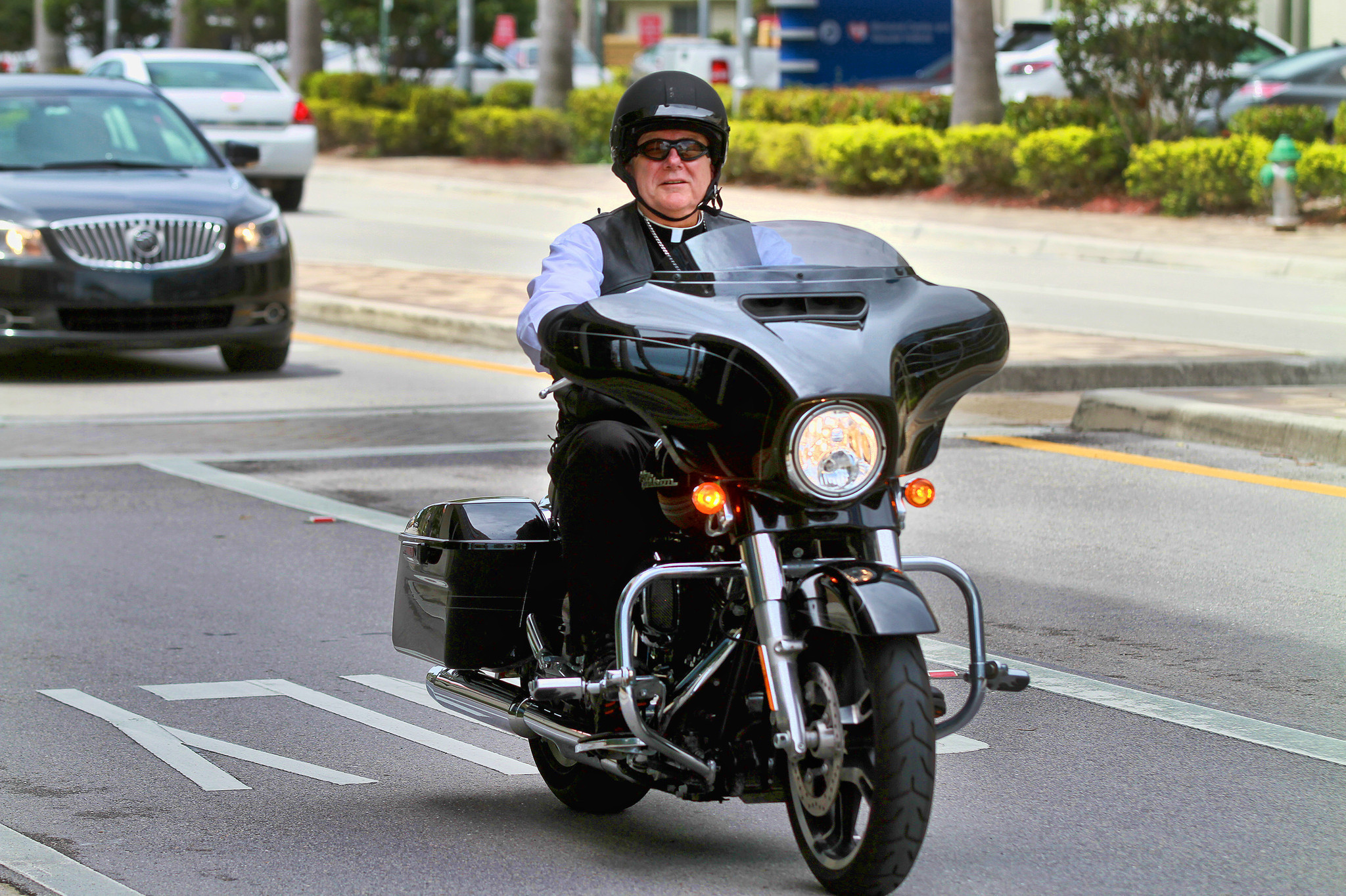 Harley riding Archbishop Thomas Wenski - Sun Sentinel