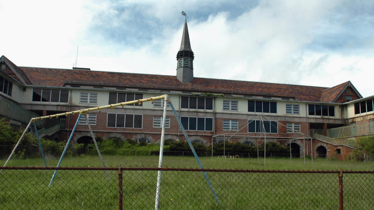 The buildings of the former Seaside Regional Center sit abandoned and in disrepair since the facility closed in 1997. (Hartford Courant)