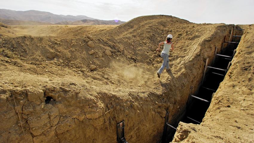 Studying a trench that reveals lines in the sediment helps a team of geologists construct a history of earthquakes on the San Andreas fault in San Luis Obispo County.