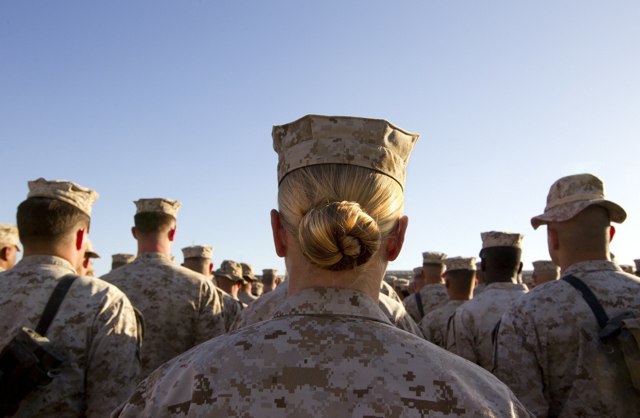 A female marine stands in formation along with her male compatriots on November 10, 2010, at Camp Delaram in Helmand province, Afghanistan.