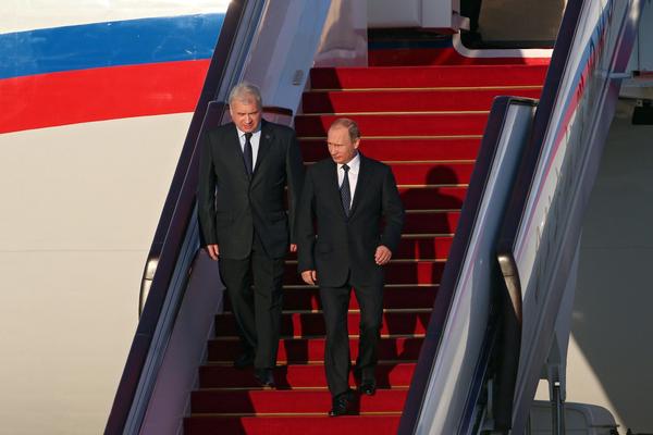 Russian President Vladimir Putin, right, arrives in Beijing on Sept. 2, 2015, to attend a military parade marking the end of World War II in Asia. (Wu Hong / European Pressphoto Agency)