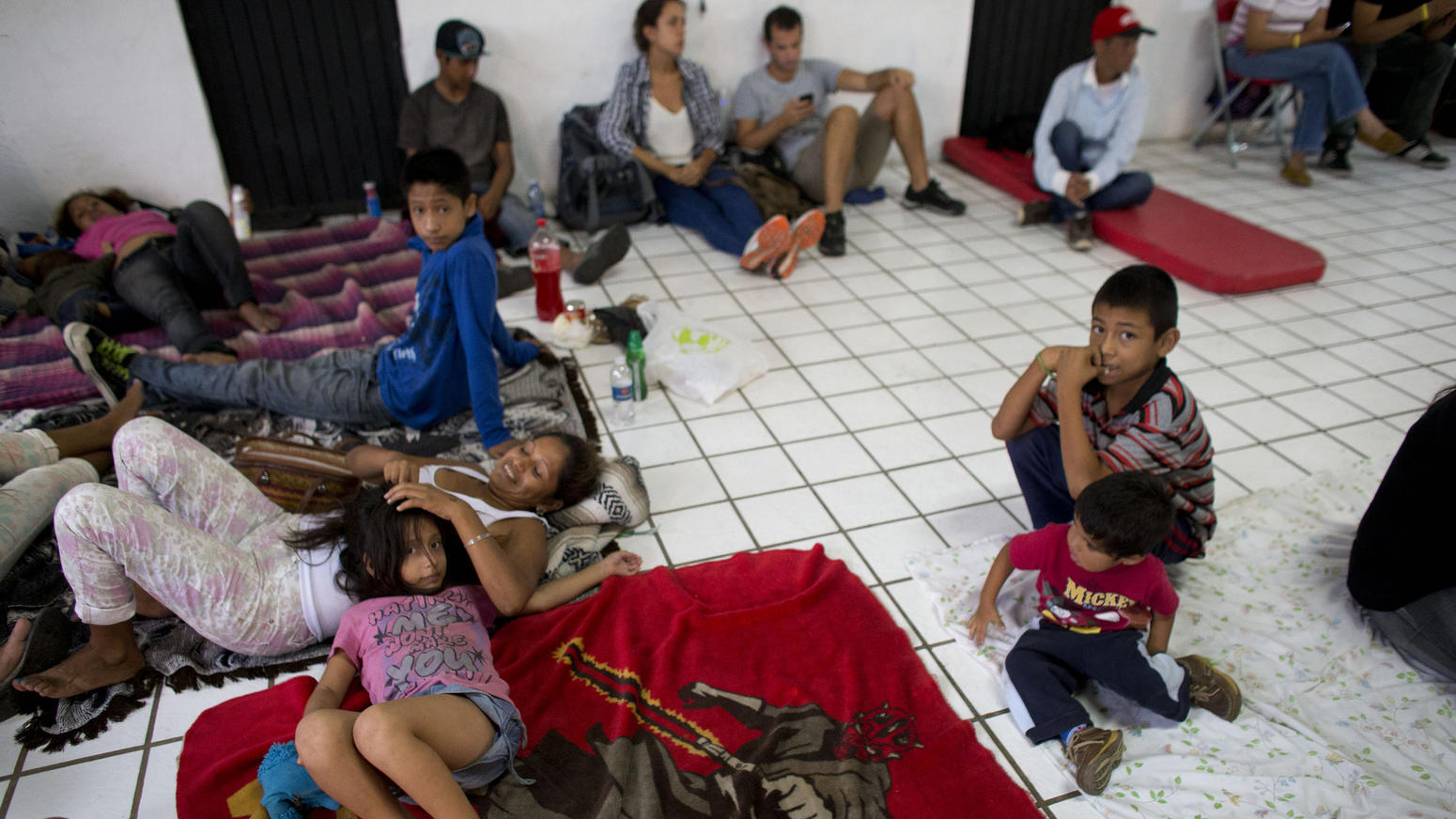 Residents and tourists took refuge in a small shelter as they awaited the arrival of the hurricane in Puerto Vallarta. (AP)