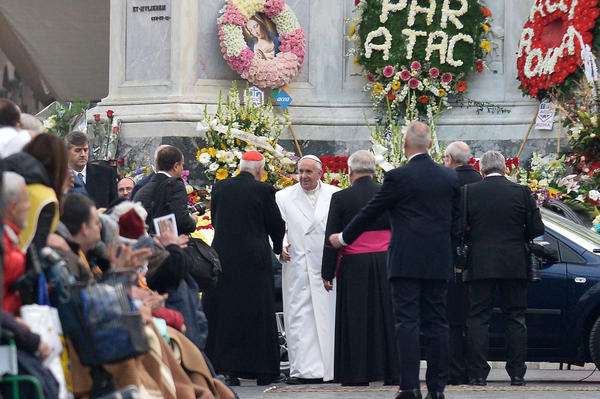 Pope Francis leaves after a prayer at the statue of the Virgin Mary during the annual feast of the Immaculate Conception at the Spanish Steps in Rome. (Tiziana Fabi / AFP/Getty Images)