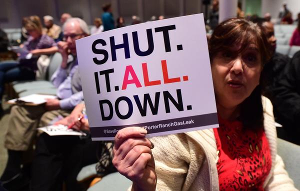 Sheryl Goldfarb, who said she has lived in Porter Ranch for 27 years, holds a placard expressing her feelings at a town hall meeting about the gas leak at Shepard of the Hills Church on Friday. (Frederic J. Brown / AFP/Getty Images)