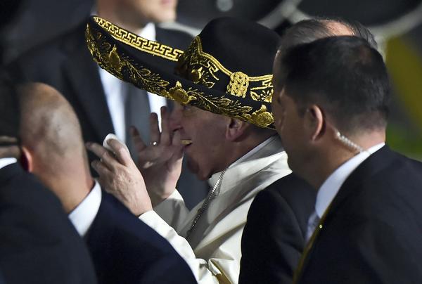 Pope Francis wears a sombrero upon arrival in Mexico City. (Ronaldo Schemidt / AFP/Getty Images)