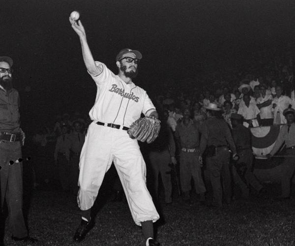 Fidel Castro throws a baseball before the start of a game between the Cuban military and the police on July 24, 1959.