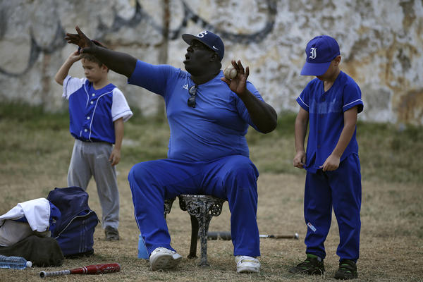 Lazaro Castillo, a retired baseball player who played for the 12-time Cuban League champion Industriales, coaches 7- and 8-year-olds in an instructional little league.