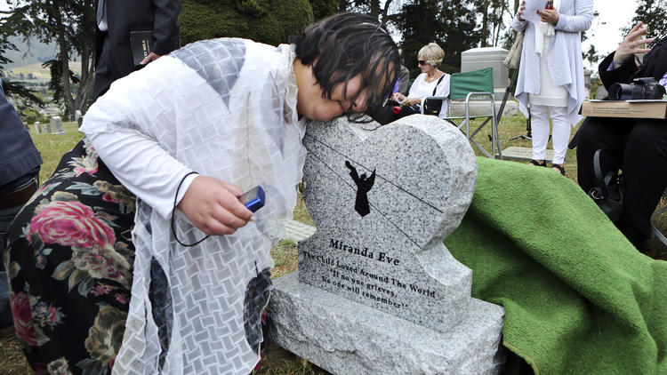 More than 100 people attended a ceremony for the girl's reburial in Colma, less than 10 miles from where she was originally buried. They christened her 'Miranda Eve.'