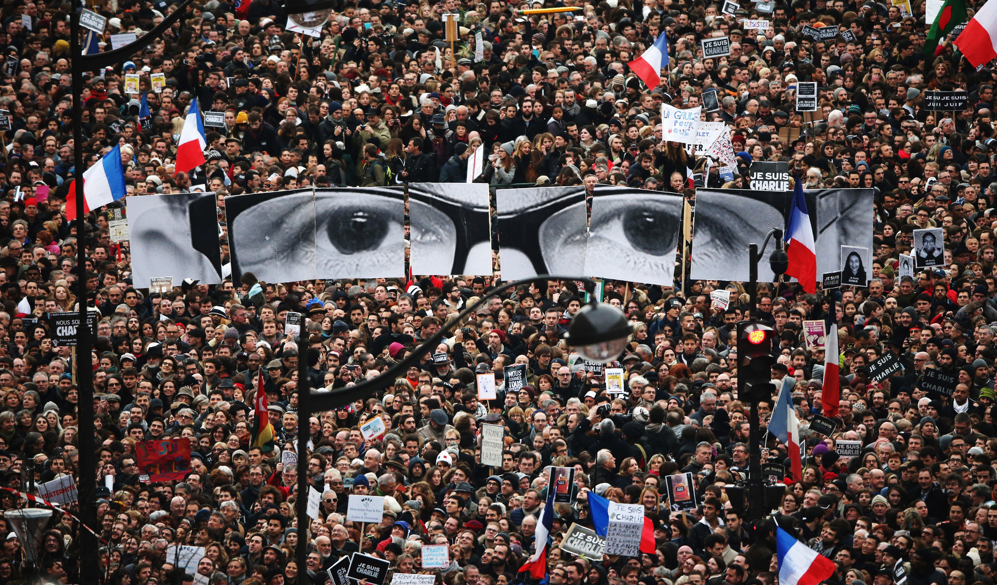 Demonstrators make their way along Boulevard Voltaire in a unity rally in Paris following terrorist attacks.