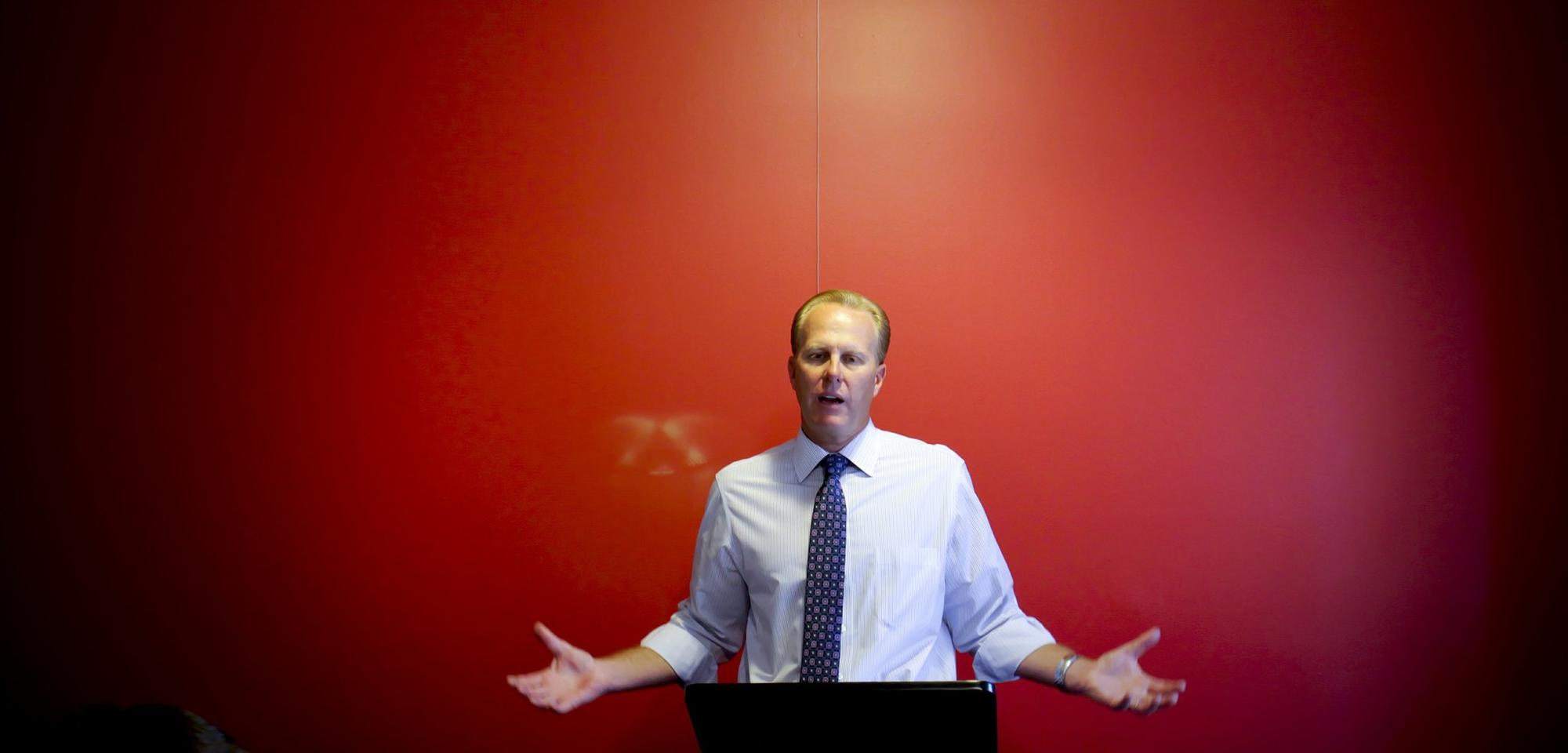 San Diego City Council member and mayoral candidate Kevin Faulconer prepares for the first mayoral debate with campaign staff members at a downtown consulting firm.