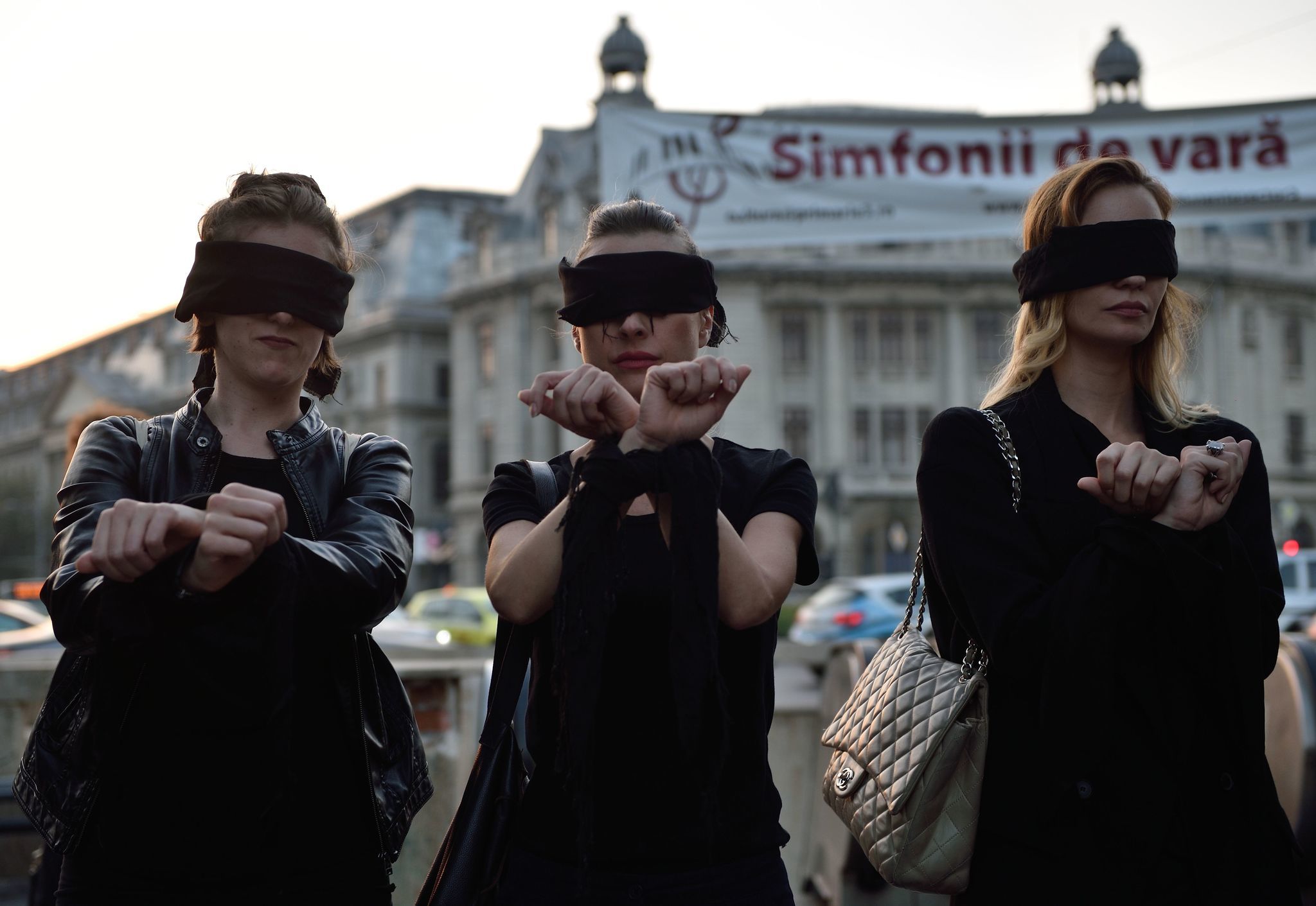 Romanian women in Bucharest show solidarity with Polish women protesting a proposed abortion law in Poland.