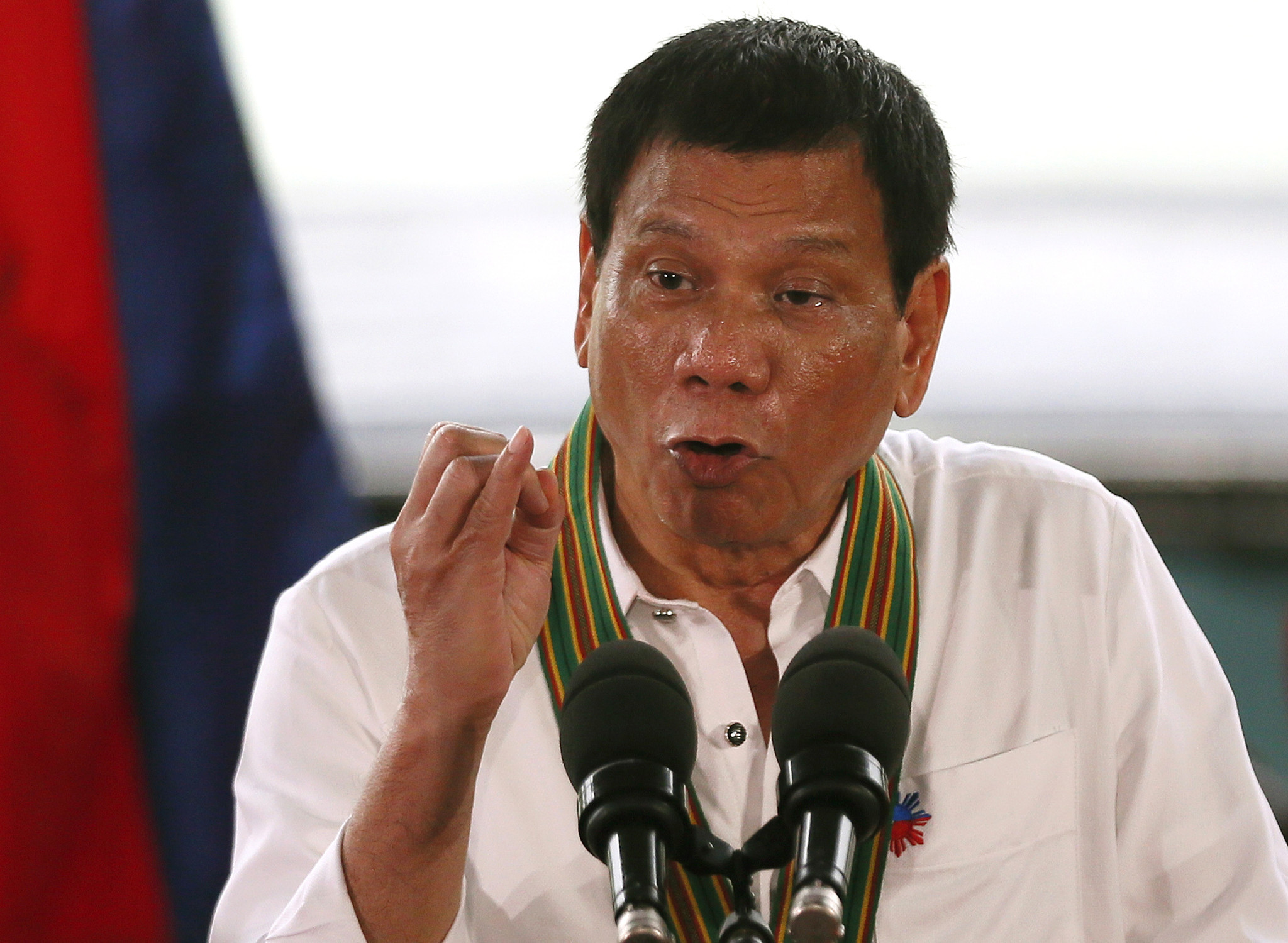 Philippine President Duterte condemned for kissing overseas worker