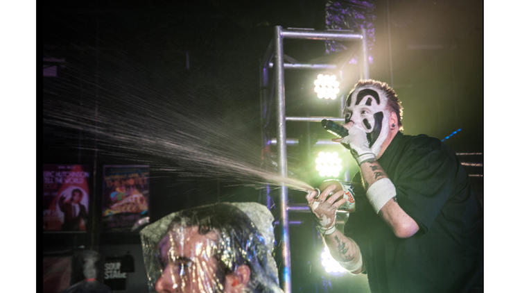 The crowd gets sprayed with Faygo.