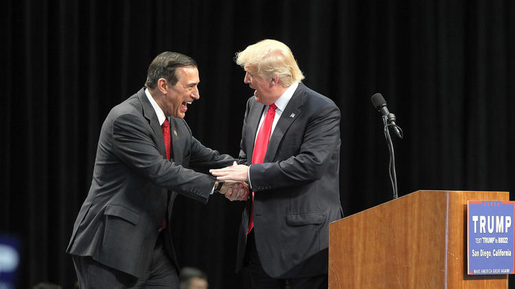 Rep. Darrell Issa, left, greets Donald Trump during a campaign rally in May.