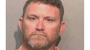Scott Michael Greene, 46, is being held in the shooting deaths of two Des Moines-area police officers.