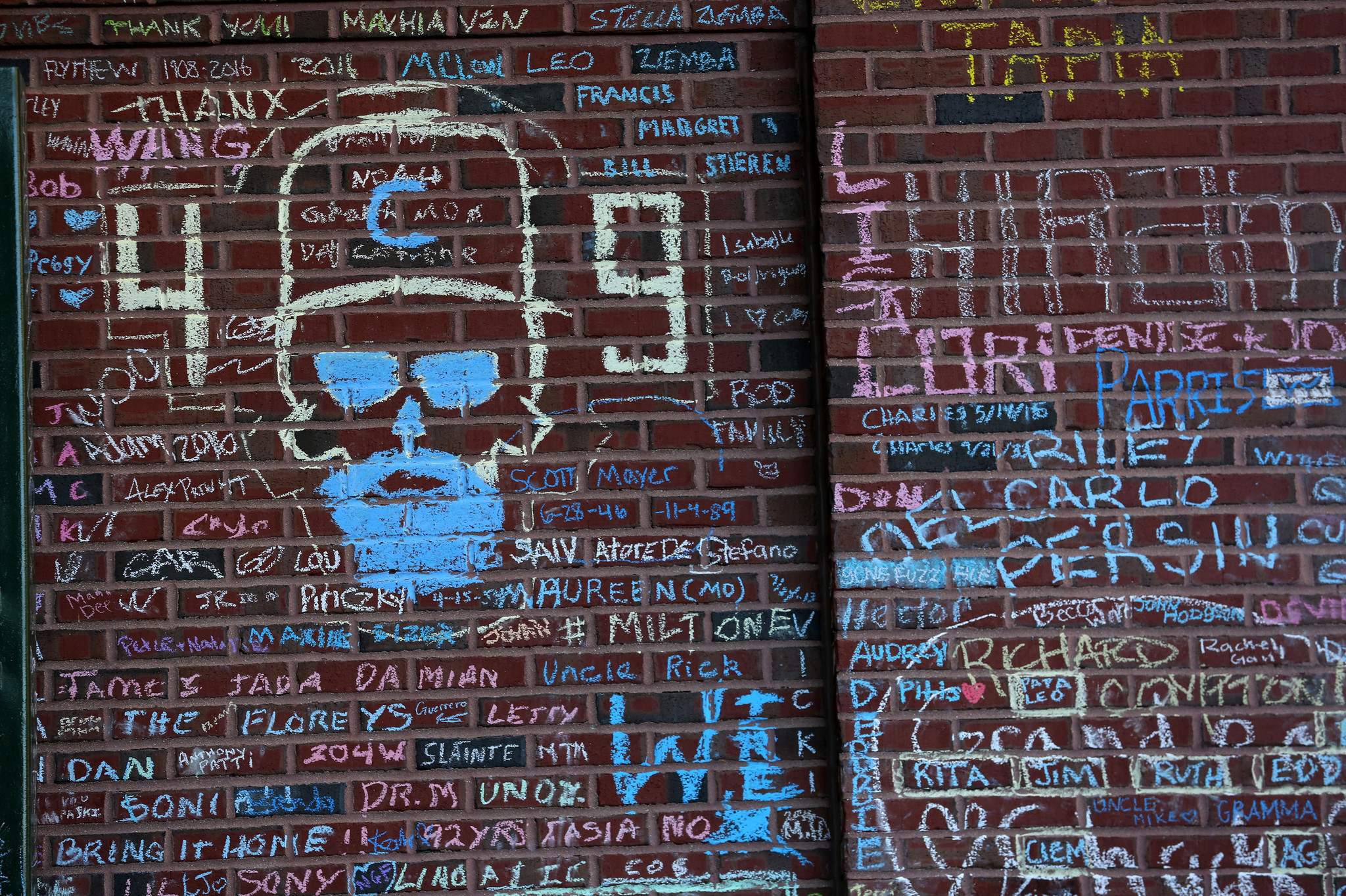 Chalk messages on the Wrigley Field wall - Chicago Tribune
